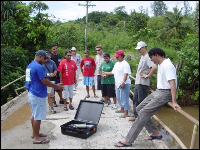 Testing water using a Yellow Springs Instruments (YSI) meter
